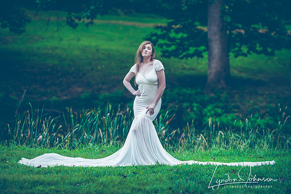 Portrait of Woman in long white dress lake