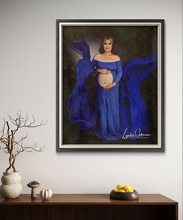 Framed portrait of pregnant woman in blue flowing dress, hanging on wall, hispanic