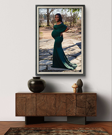 Black pregnant woman in green dress in garden, framed, hanging on wall