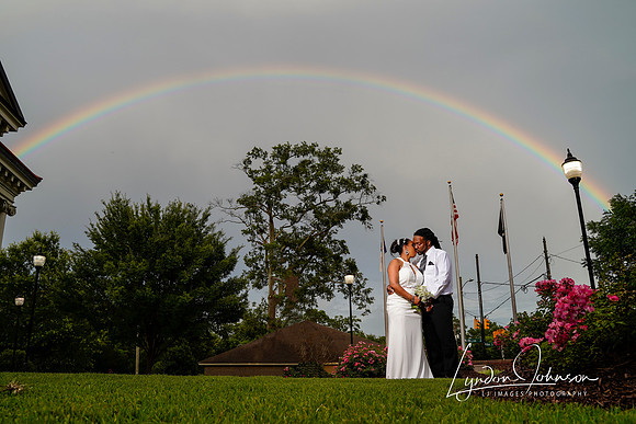 Wedding portrait with a natural rainbow, couple in downtown Goldsboro, NC,